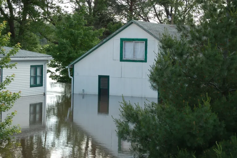 House surrounded by floodwater up to the windows