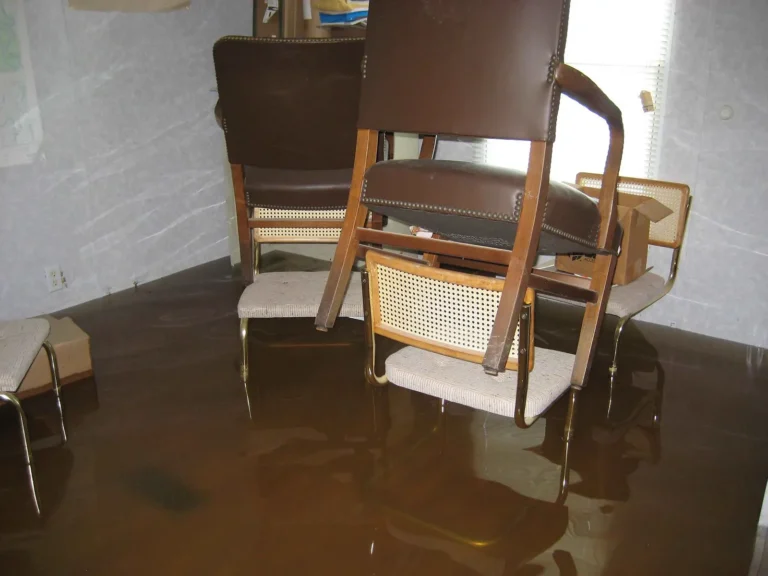 Room with chairs standing in floodwater
